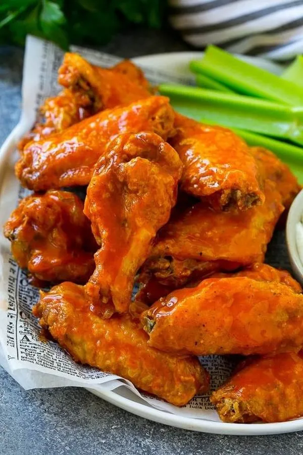 Buffalo sauced chicken wings with celery